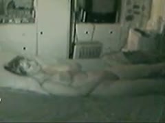 A nude wife was captured on hidden camera masturbating and relaxing.